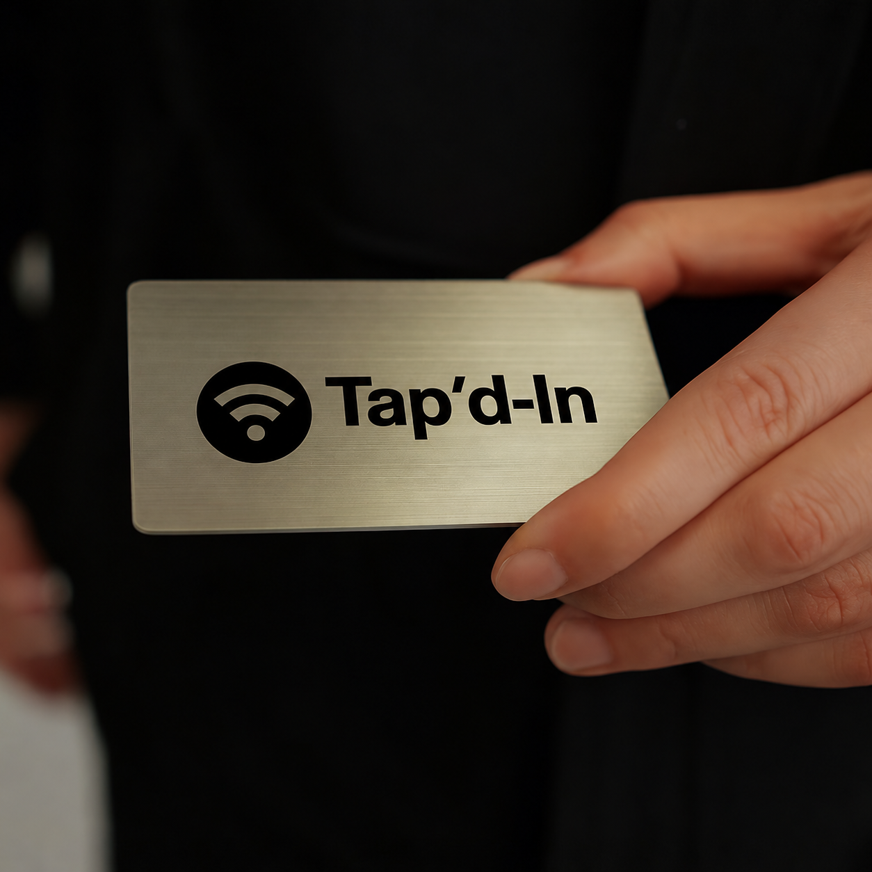Tap'd-In metal card in hand
